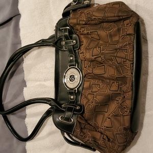 Brown handbag with black trim